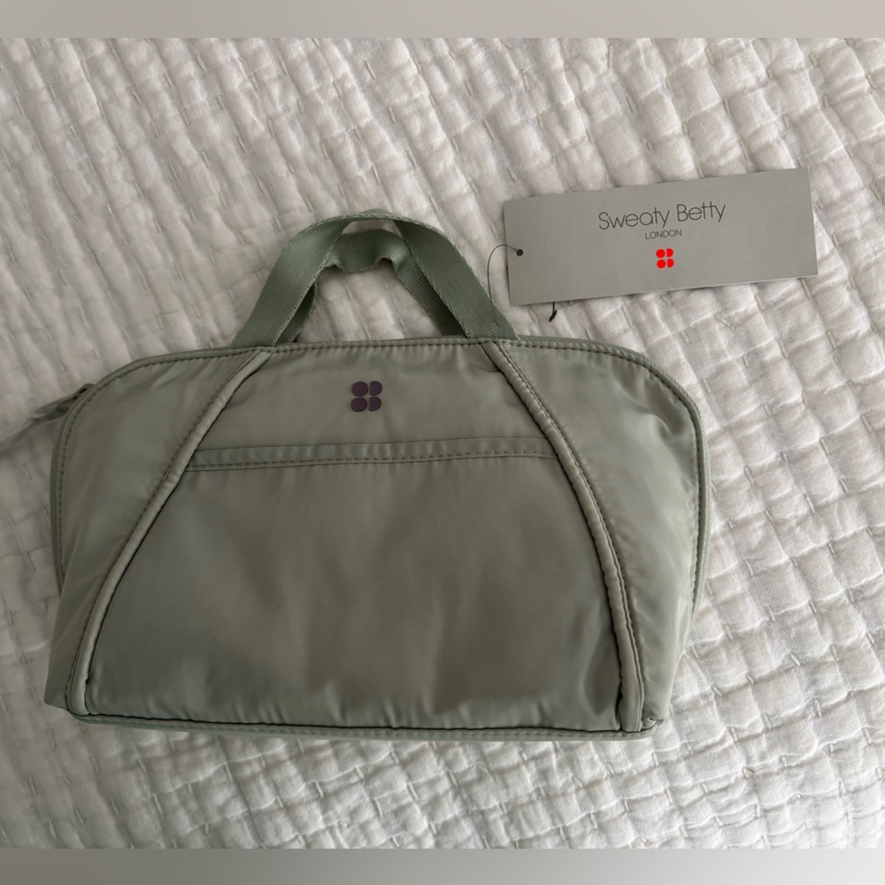 Sweaty Betty I on washbag in sage green